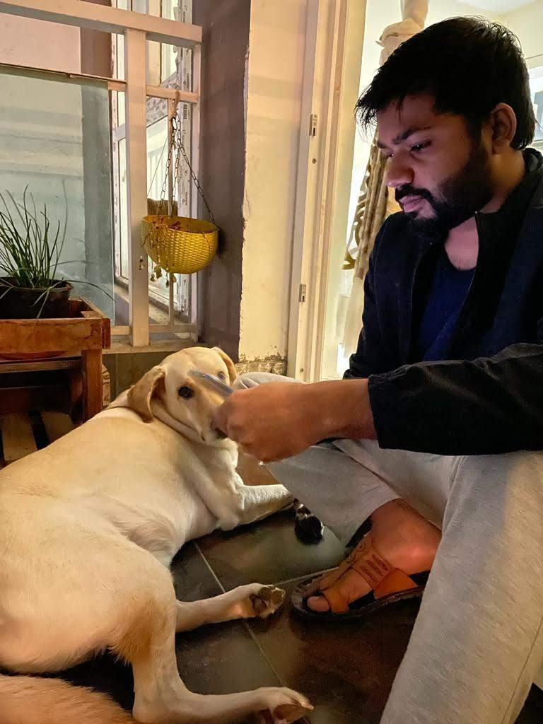 Kartikeya with his golden retriever dog